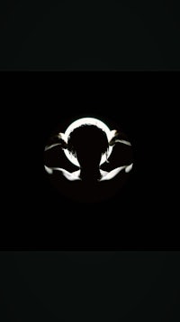 a silhouette of a person in a dark room